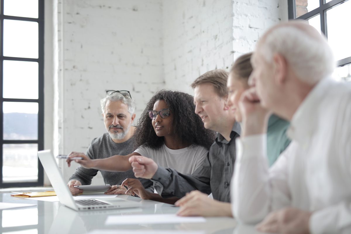 Senior pharma leadership team in discussion