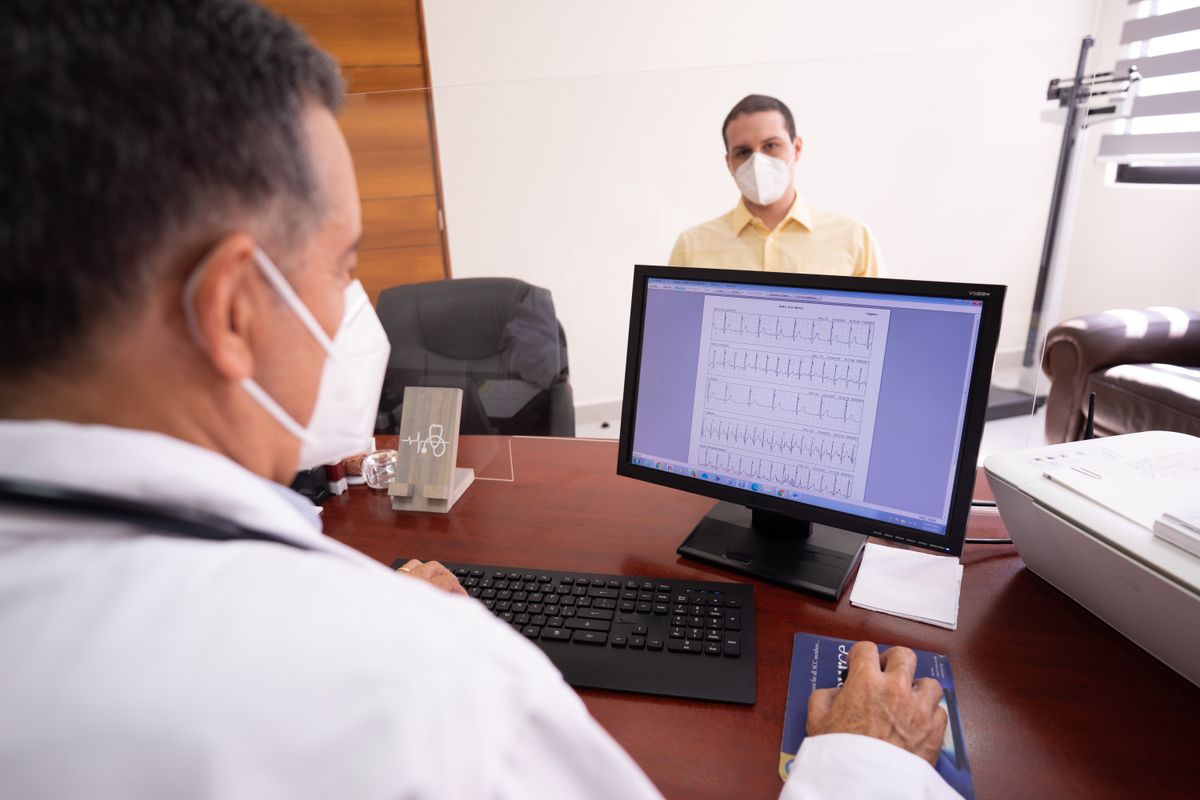 A clinician reviewing records at a desk